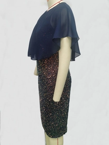 Detail of navy blue chiffon cape and sparkling multi-color sequin dress fabric