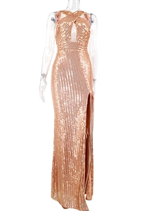 Detail of gold sequin dress with cross halter neck and high slit on transparent mannequin