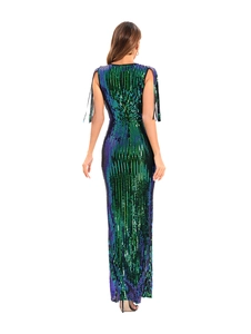 Detail of green sequin dress back showing sparkling gradients and black shoulder fringe