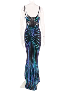 Detailed back view of sequined evening gown with criss-cross straps and fishtail hemline