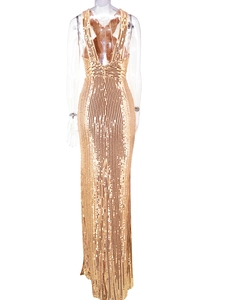Detail of a backless golden sequin dress featuring a slim-fit evening gown silhouette