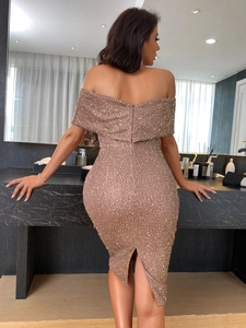 Detailed back view of sequin dress featuring hidden zipper and elegant back slit detail