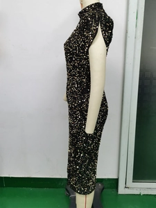 Detail of a vintage sequined sleeveless dress with gold shimmering circular sequins