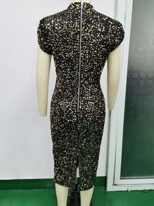 Detail of the silver metal zipper on the back of this sequined bodycon midi dress
