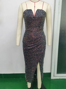 Detailed close-up of rainbow sequins on a slim-fit navy cocktail dress with high side slit