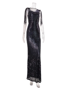 Detailed view of black sequins and tassel sleeves on a mesh neckline evening gown