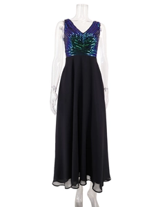 Close-up of sleeveless V-neck dress with blue green sequins and black chiffon skirt
