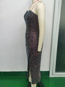 Detailed side view of sequin evening gown featuring a high slit and thin straps