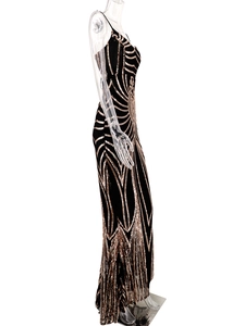 Detailed view of Art Deco geometric sequins and mermaid hem on a rose gold evening dress