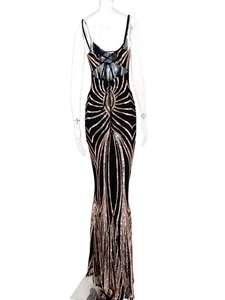 Detailed back view of backless sequin evening dress with crisscross straps and rose gold glitter
