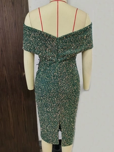 Close-up of dark green sequin dress back detail with high-quality invisible zipper