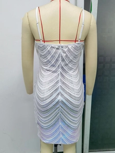 Detail of white sequin bodycon dress showing silver V-pattern embroidery and back zipper