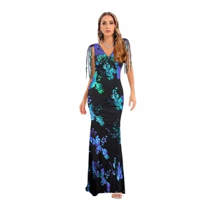 Robe de soirée sexy pailletée verte dos nu avec franges et coupe sirène élégante
