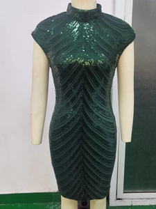 Detail of dark green sequin bodycon dress with mock neck and cap sleeves