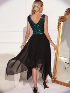 Detail of sequined gradient V-back bodice and flowing asymmetrical chiffon skirt hem