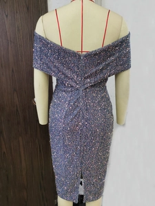Detailed close-up of sequin fabric with invisible back zipper and stylish slit design