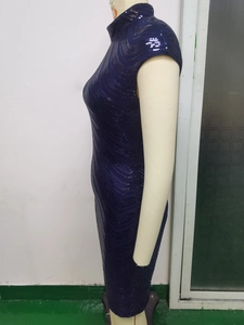 Detail of navy blue sleeveless sequin dress with wavy texture and standing collar design