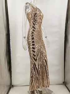 Detail of gold sequin evening dress with geometric patterns and shimmering mesh fabric