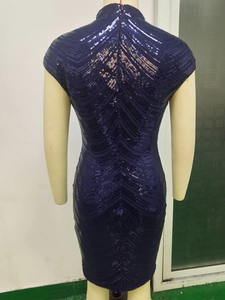 Detail of navy blue sequin dress with V-shaped wave patterns and invisible back zipper
