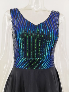 Detail of V-neck sequined dress with blue-green gradient sequins and black A-line skirt