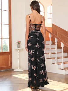 Close-up of sheer mesh back detail and rose gold sequin embroidery on black dress