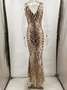 Detail view of sparkly sequins and geometric patterns on a fishtail evening gown