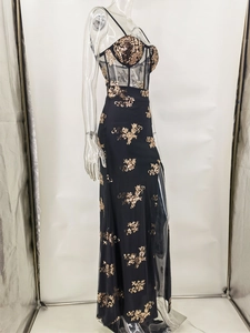 Close-up of sheer black mesh bodice with gold sequin floral embroidery and waist detail
