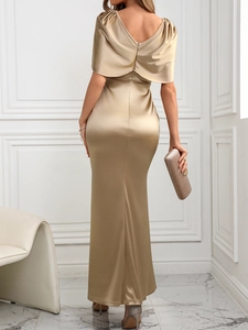Detailed back view of a champagne satin evening gown featuring an open back and ruffles
