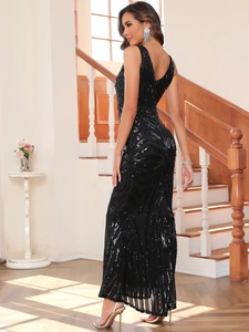 Detail of elegant black sequin evening gown with V-neck and geometric pattern