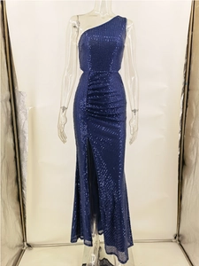 Detailed close-up of navy blue sequined evening gown with side slit and pleated waist