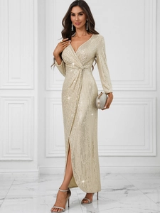 Detailed close-up of champagne gold sequined evening dress with v-neck and high side slit