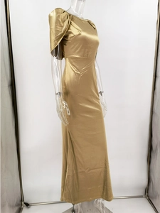Detail of elegant gold satin evening gown with pleated shoulder and round neckline