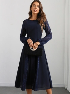 Detail of elegant dark blue dress with sheer lace long sleeves and A-line chiffon skirt