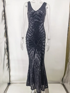 Detailed close-up of a sequin evening gown featuring black radial geometric patterns.