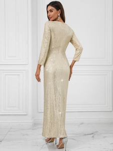 Detail of elegant champagne sequined evening gown featuring a deep V-back and long sleeves