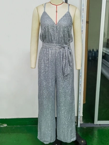 Sparkly silver sequin jumpsuit with deep V-neck and wide legs on a mannequin display