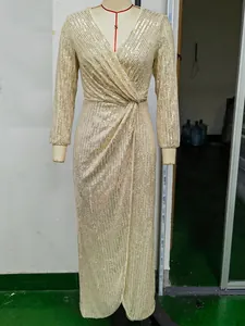 Sparkly champagne gold sequin long sleeve maxi dress with deep V-neck and twist front design