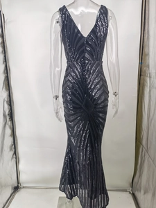 Detailed view of backless sequin dress with mermaid hem and geometric silver patterns