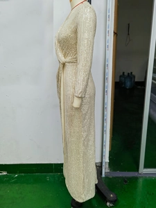 Detail of champagne gold sequin long dress with deep V-neck and wrap waist design