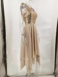 Detail of champagne gold sequin bodice and layered chiffon high-low hemline on the dress
