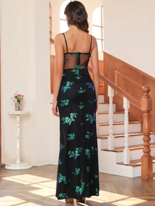 Detailed back view of a sheer black sequin dress featuring blue and green floral patterns