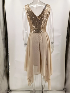 Detail view of champagne gold sequin stitching and asymmetrical chiffon hem on evening dress