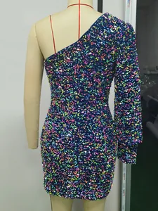 Detail view of colorful sequin mini dress featuring one-shoulder design and slim fit cut