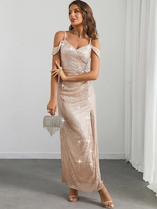 Detail of champagne sequin evening dress featuring a cold-shoulder neckline and high slit