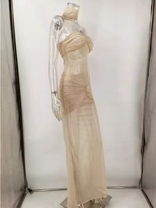 Macro view of champagne sequin mesh fabric with elegant ruched waist detailing