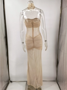 Detail of champagne gold sequin evening dress with halter neck and back zipper closure