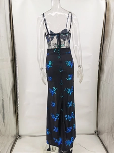 Detail of sheer black floral lace back and sparkling blue-green sequin embroidery