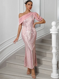 Detail of pink sequin one-shoulder evening gown with chiffon ribbon on white stairs