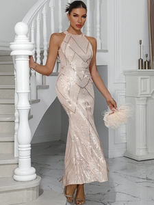Detail of elegant sequined fishtail evening dress with backless design and halter neckline