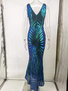 Macro shot of V-neck sequin dress with blue and green radial fan patterns